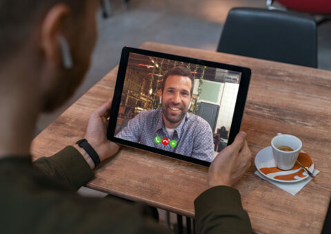 Man doing video call on tablet